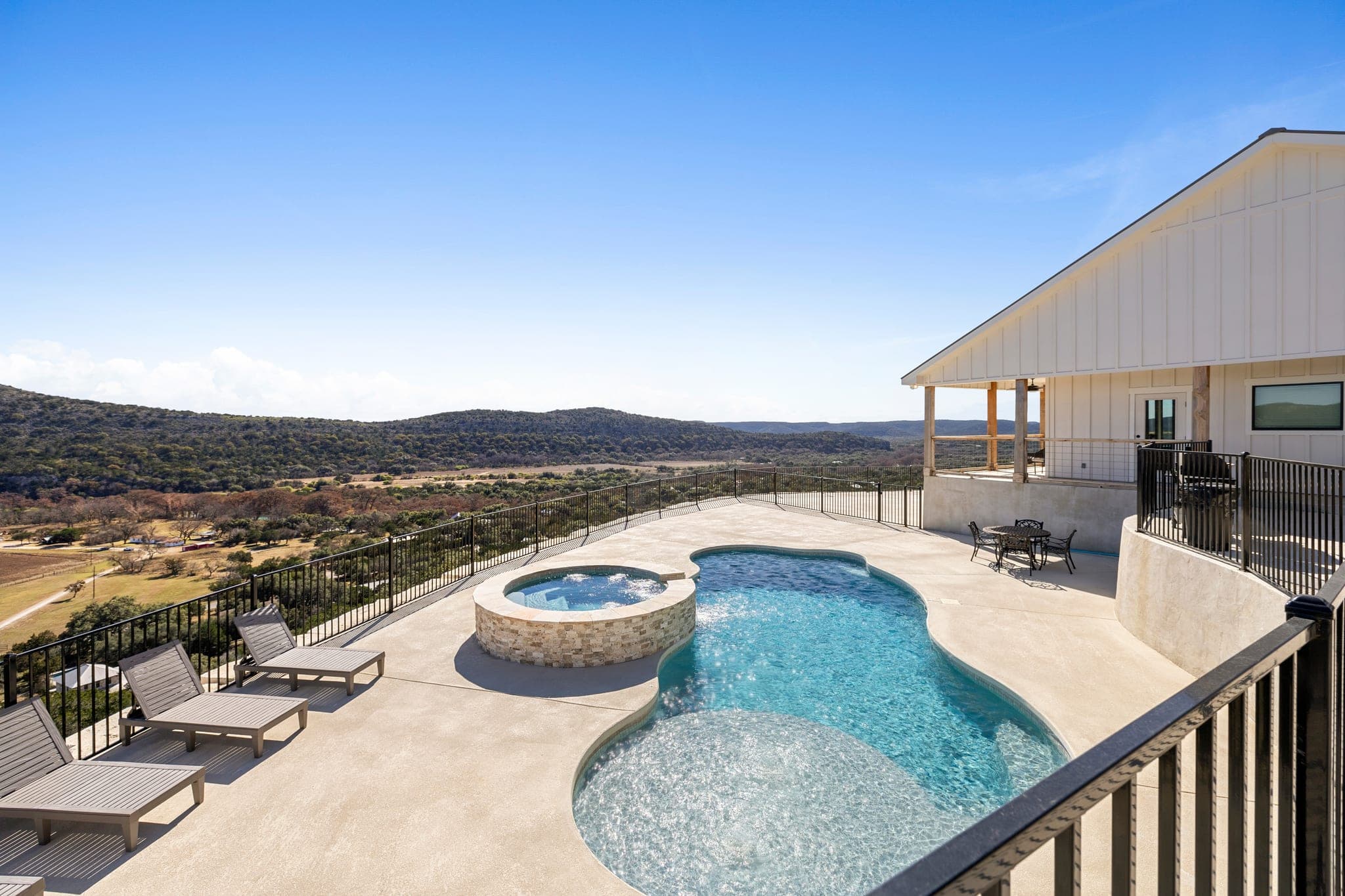 Hill Country pool, spa, and outdoor entertaining area
