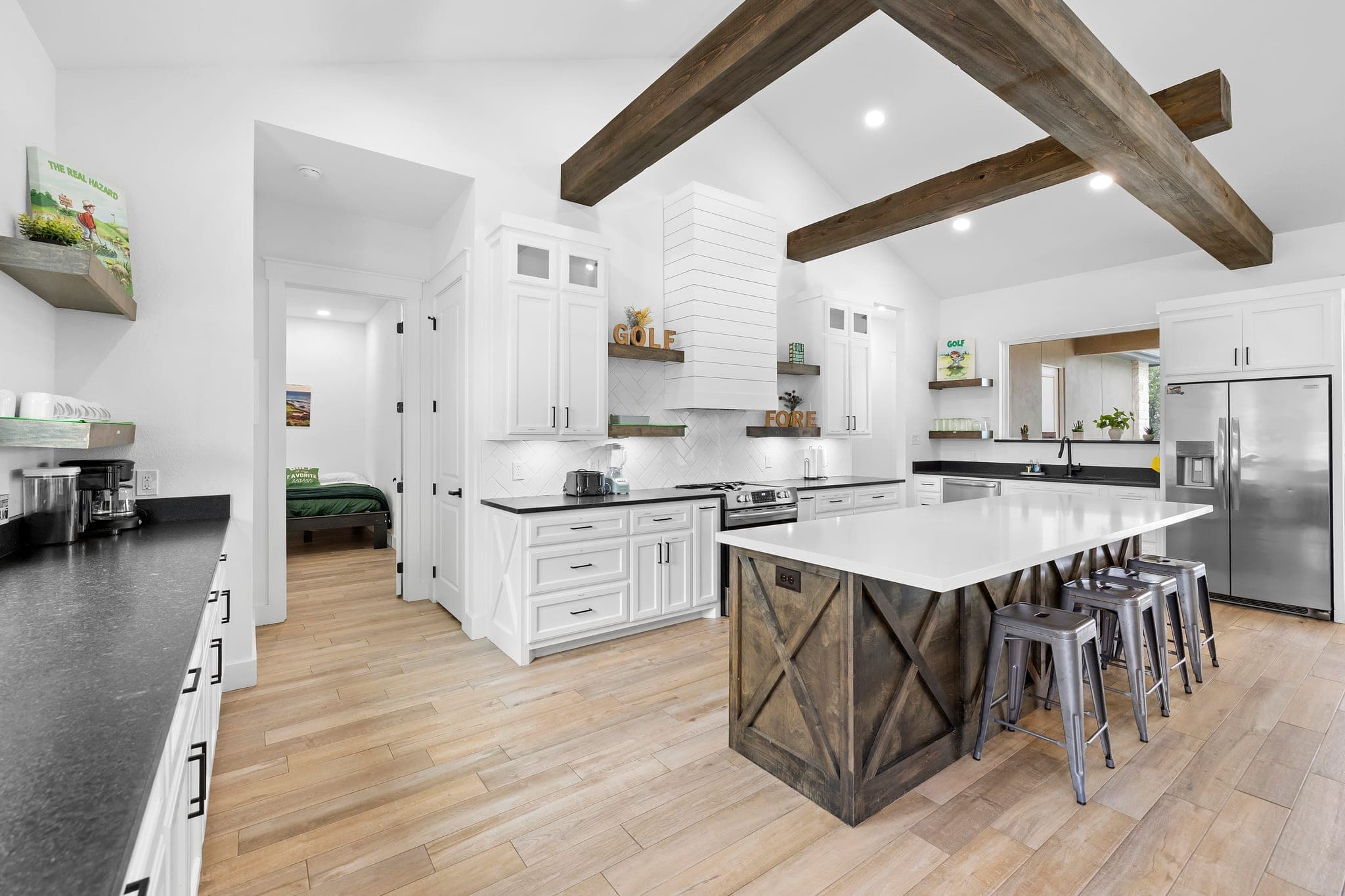 Modern white kitchen with a contrasting wood island