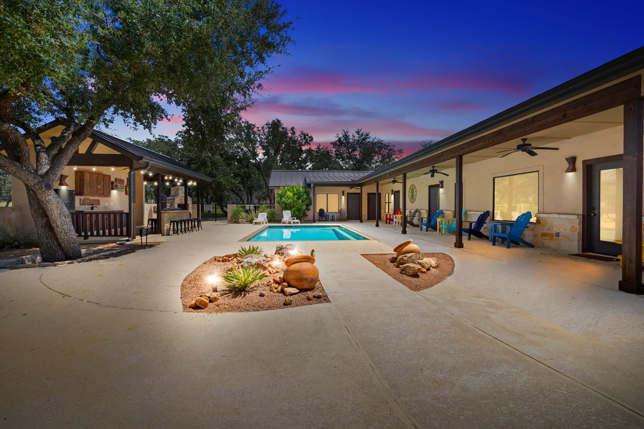 Covered ranch patio and pool photographed at twilight